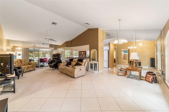 tiled living room with vaulted ceiling and ceiling fan with notable chandelier