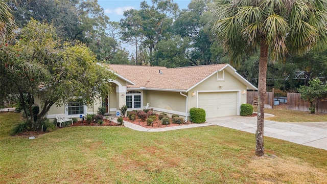 ranch-style home featuring a garage and a front yard