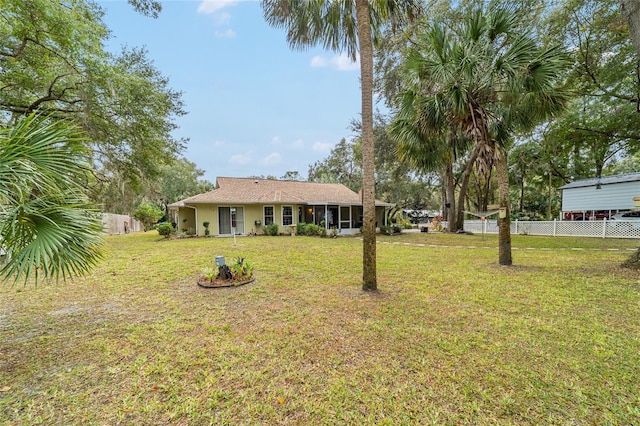 view of yard with a sunroom