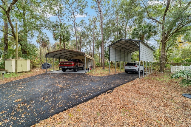 view of vehicle parking with a carport