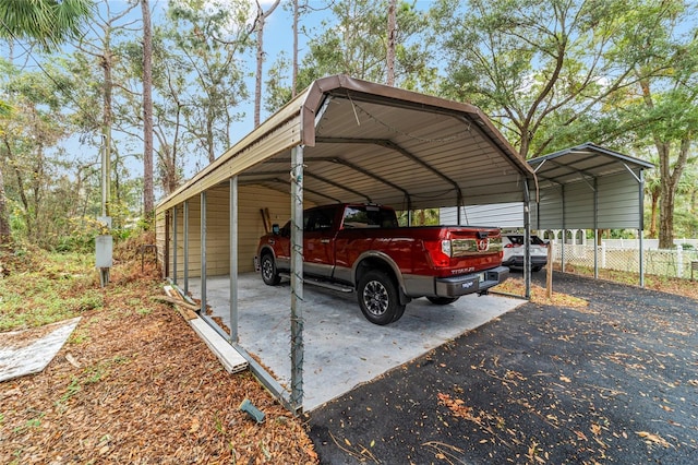 view of vehicle parking with a carport