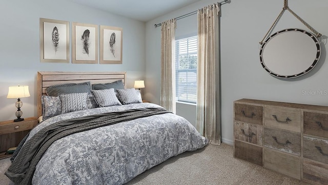 carpeted bedroom with lofted ceiling