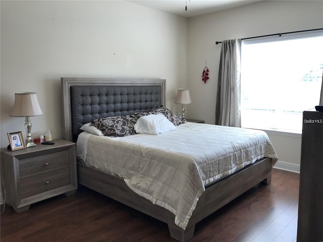 bedroom featuring dark hardwood / wood-style flooring