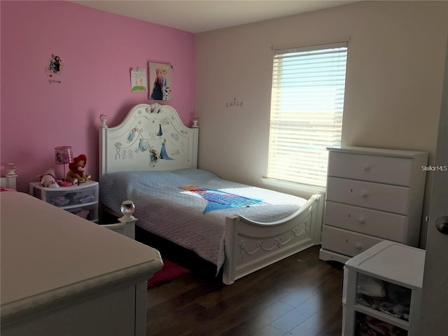 bedroom featuring dark hardwood / wood-style floors