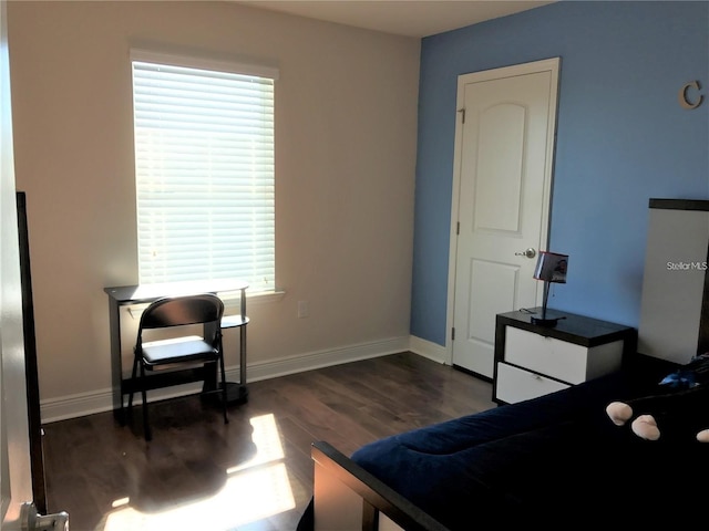 bedroom featuring dark hardwood / wood-style floors