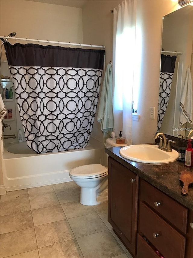 full bathroom featuring tile patterned flooring, vanity, toilet, and shower / bathtub combination with curtain