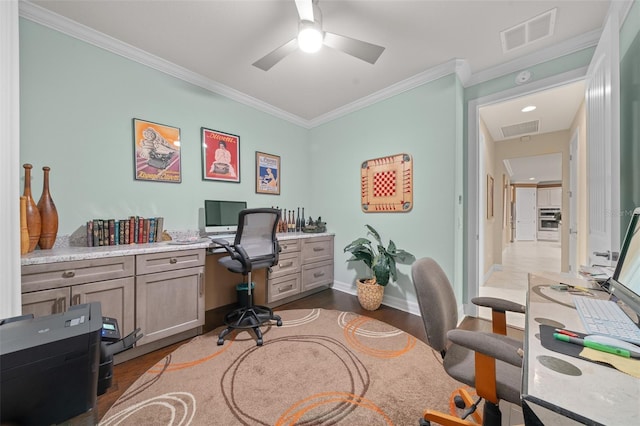 office space with dark hardwood / wood-style flooring, ceiling fan, and crown molding