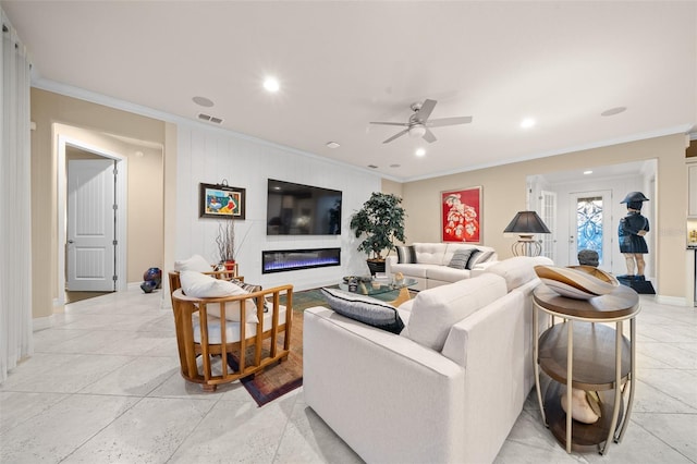 living room with ceiling fan and crown molding