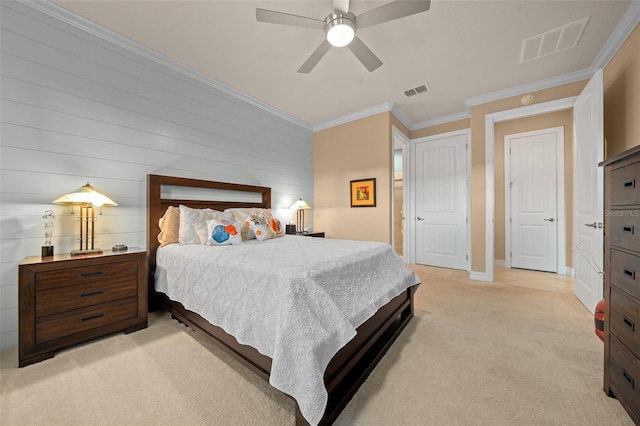 bedroom with ceiling fan, light colored carpet, and crown molding