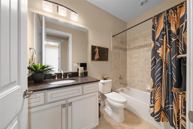 full bathroom with tile patterned flooring, shower / bath combination with curtain, vanity, and toilet