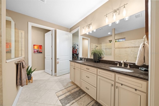 bathroom featuring a shower, tile patterned flooring, and vanity