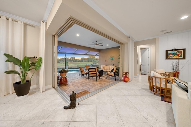 interior space featuring ceiling fan and ornamental molding