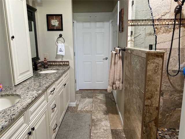 bathroom featuring vanity and an enclosed shower