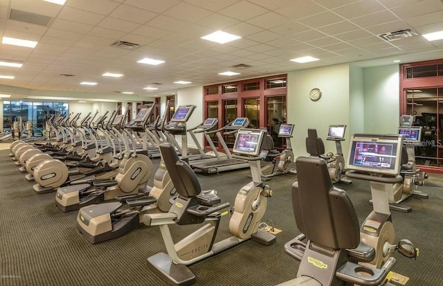 exercise room featuring a paneled ceiling