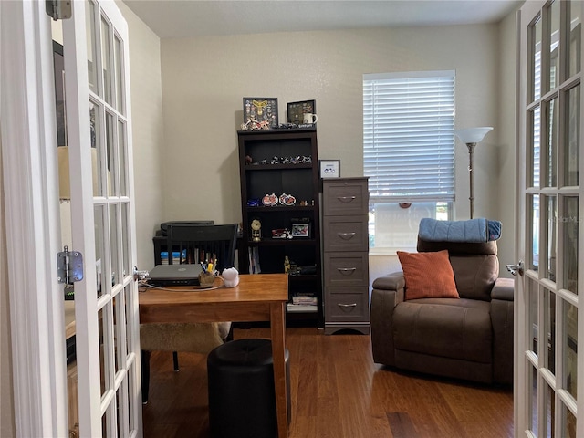 home office with dark wood-type flooring and french doors