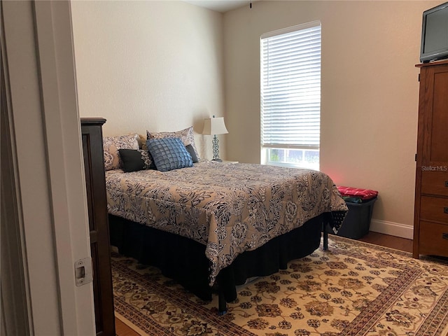 bedroom featuring dark hardwood / wood-style floors