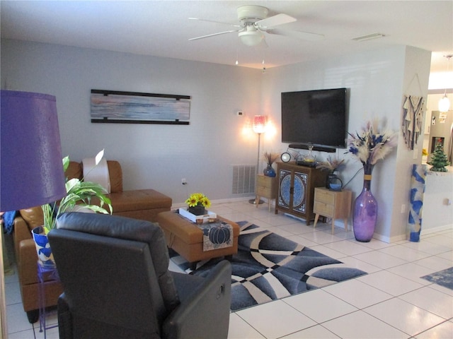 living room featuring ceiling fan and light tile patterned flooring