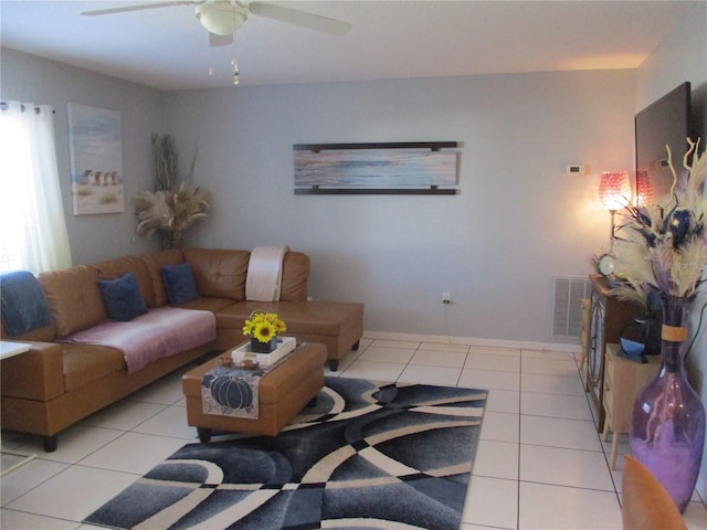 living room with light tile patterned floors and ceiling fan