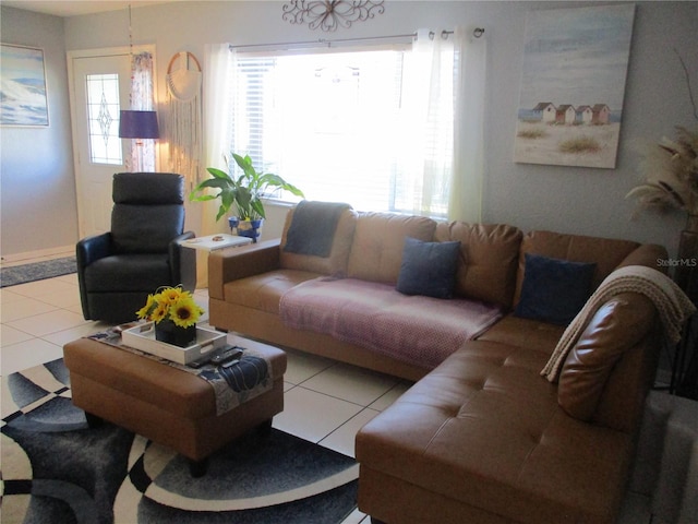 living room with tile patterned flooring and a healthy amount of sunlight