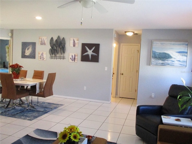 dining space with ceiling fan and light tile patterned floors