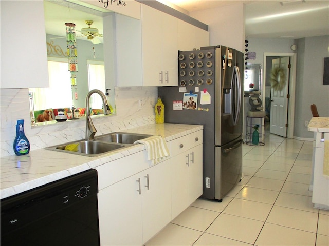 kitchen with white cabinets, dishwasher, light tile patterned floors, and sink