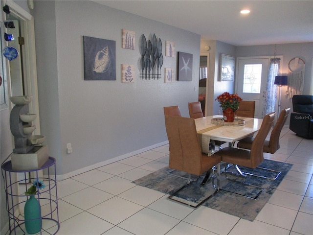 dining area featuring light tile patterned floors