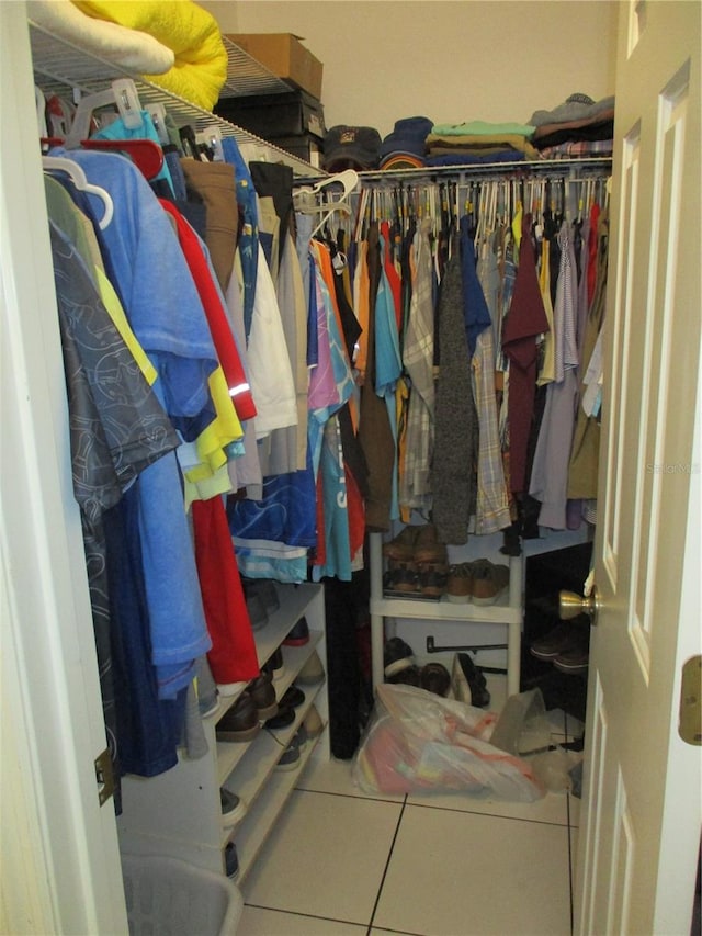 spacious closet featuring tile patterned flooring