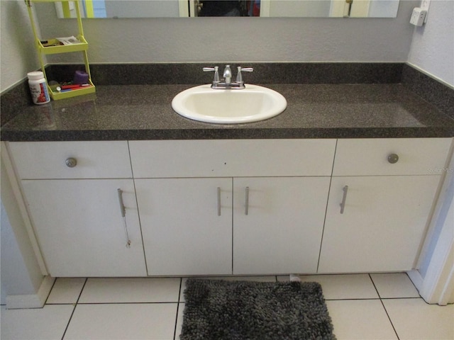 bathroom with vanity and tile patterned floors