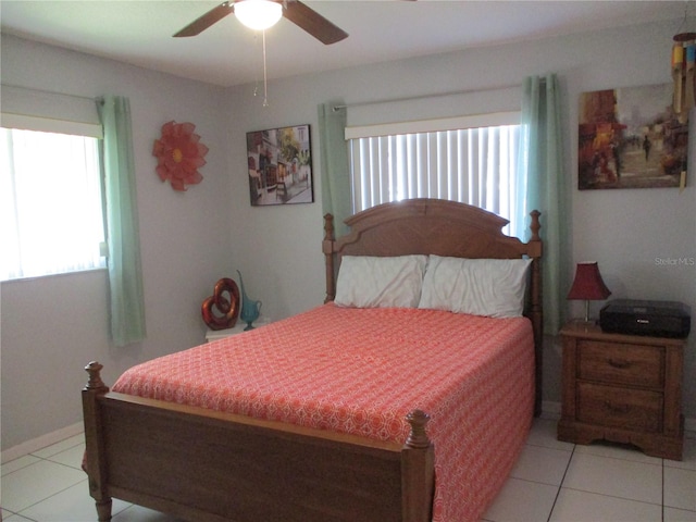 bedroom with ceiling fan and light tile patterned floors