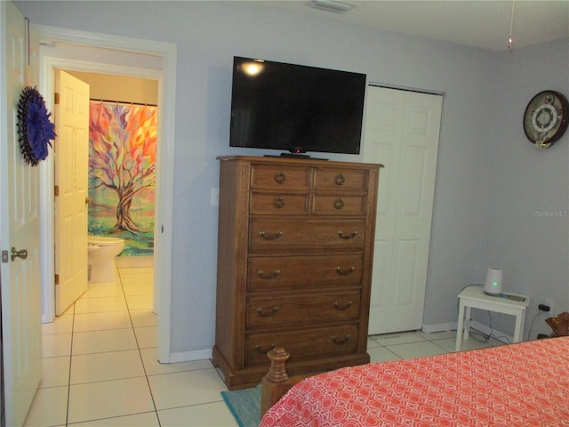 tiled bedroom with connected bathroom