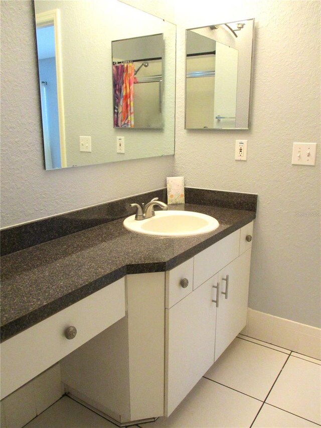 bathroom featuring vanity and tile patterned floors