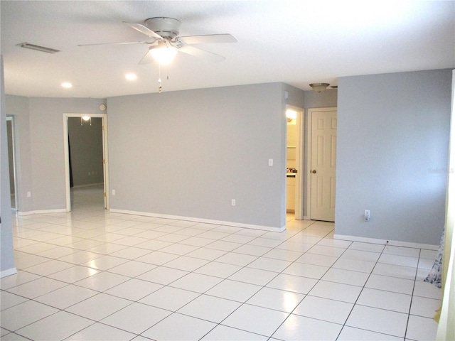 unfurnished room featuring light tile patterned flooring and ceiling fan