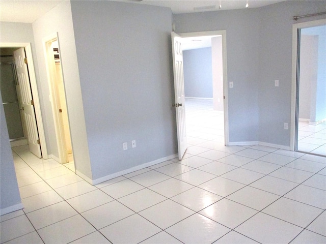 empty room featuring light tile patterned floors