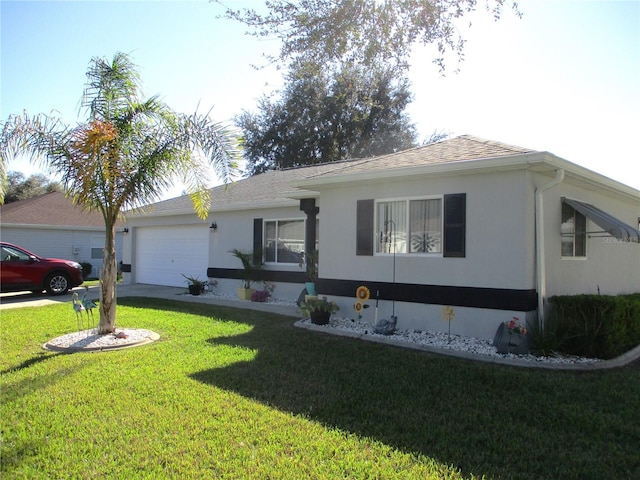 ranch-style house with a garage and a front yard