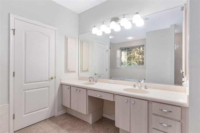 bathroom with vanity and a tub