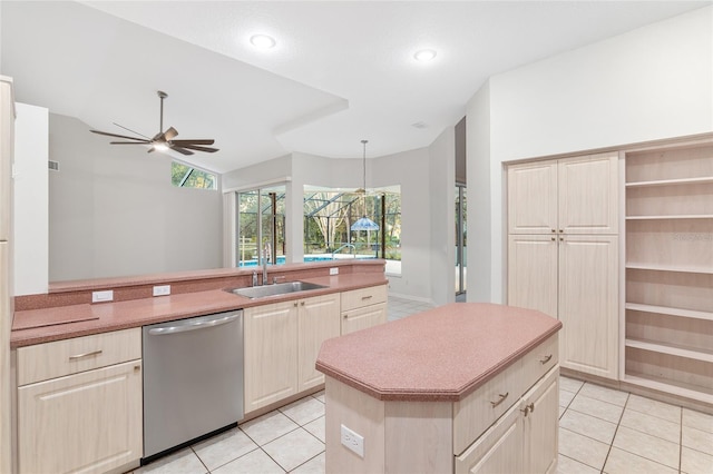 kitchen featuring stainless steel dishwasher, ceiling fan, sink, decorative light fixtures, and light tile patterned flooring