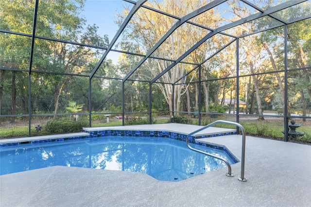 view of swimming pool with a lanai and a patio