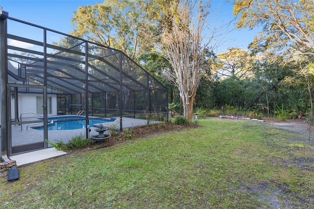 view of yard with glass enclosure