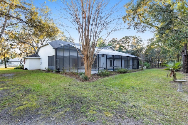 view of yard featuring glass enclosure