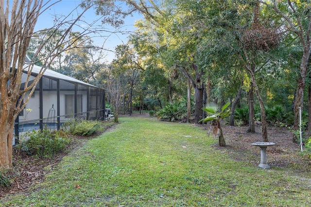 view of yard featuring a lanai