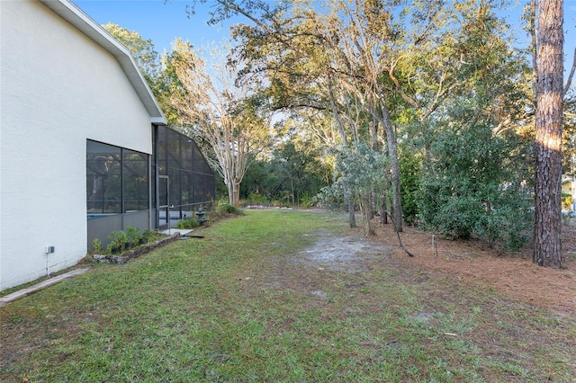 view of yard with a lanai