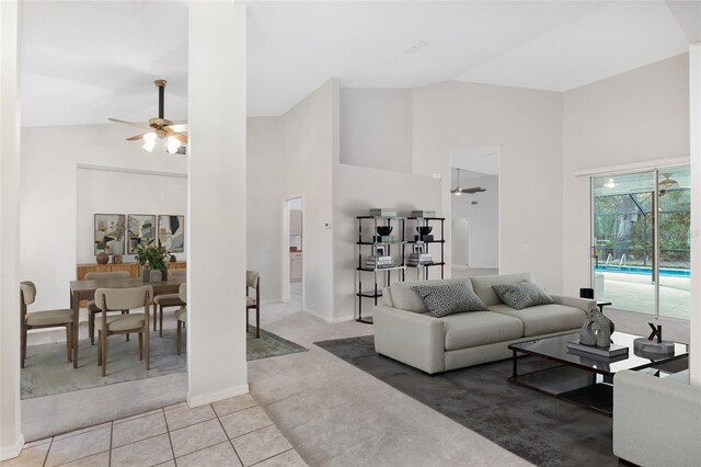 2843 W Elm Blossom St, Beverly Hills, FL 34465 - carpeted living room featuring ceiling fan, high vaulted ceiling, and tile patterned flooring