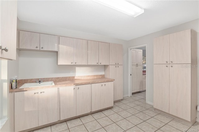 2843 W Elm Blossom St, Beverly Hills, FL 34465 - kitchen featuring light countertops, light brown cabinets, and light tile patterned floors