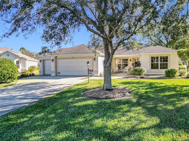 ranch-style home featuring a garage and a front lawn