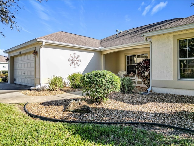 view of side of home featuring a garage