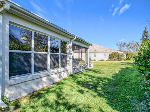 view of yard featuring a sunroom