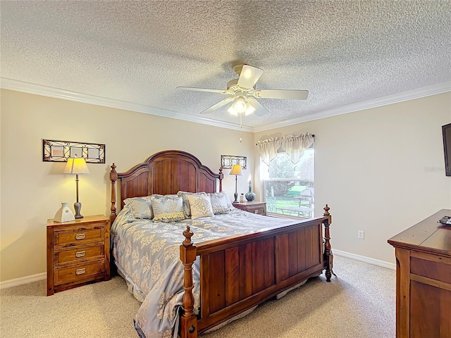 carpeted bedroom with ceiling fan, a textured ceiling, and ornamental molding