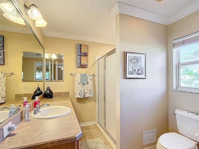 bathroom with ornamental molding, a textured ceiling, a shower with door, tile patterned flooring, and toilet