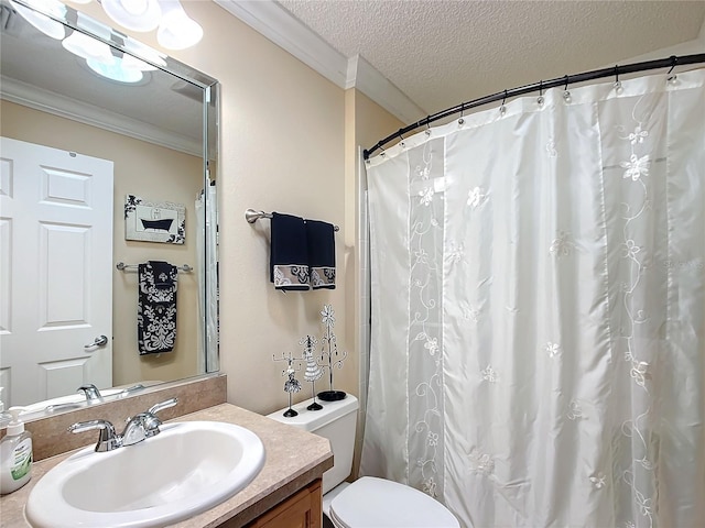 bathroom featuring crown molding, vanity, a textured ceiling, and toilet