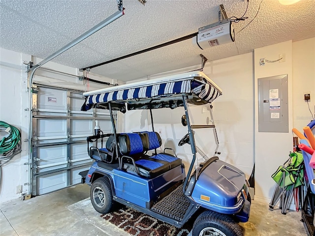 garage with electric panel and a garage door opener